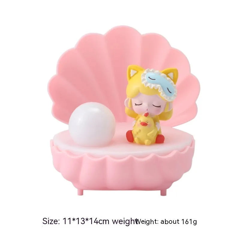 Cartoon resin small night lamp in pink pig girl colour on a bedside table