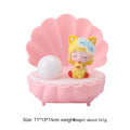 Cartoon resin small night lamp in pink pig girl colour on a bedside table