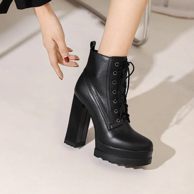 Women's chunky heel waterproof platform high heel boots in black cowhide leather with side zipper and round toe.