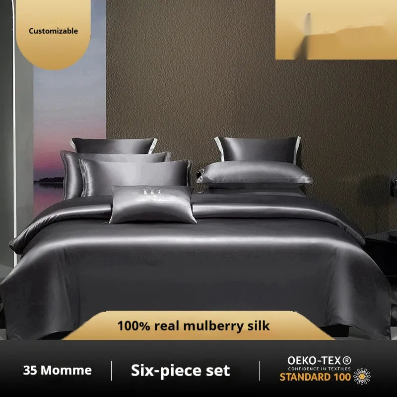 Solid colour silk four-piece bedding set in Champagne Gold on a bed, showing quilt cover and pillowcases.