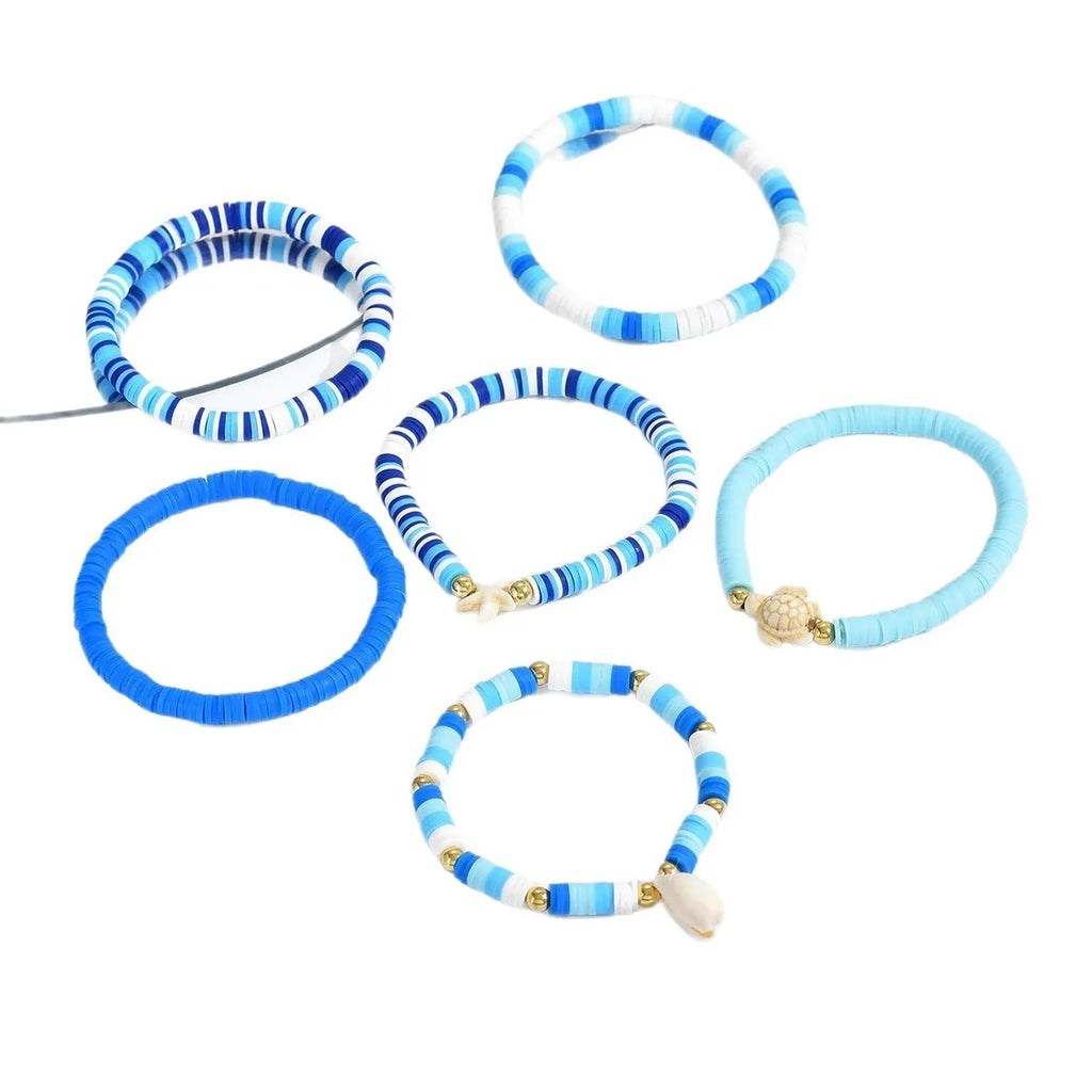 Set of six blue polymer clay handmade shell bracelets with geometric design, unisex bohemian style