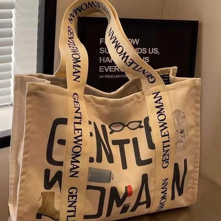 Canvas women's travel tote shopping bag in large capacity format with printing elements