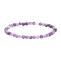 Purple natural stone elastic bead bracelet on a light surface, showing geometric beads in 10mm size