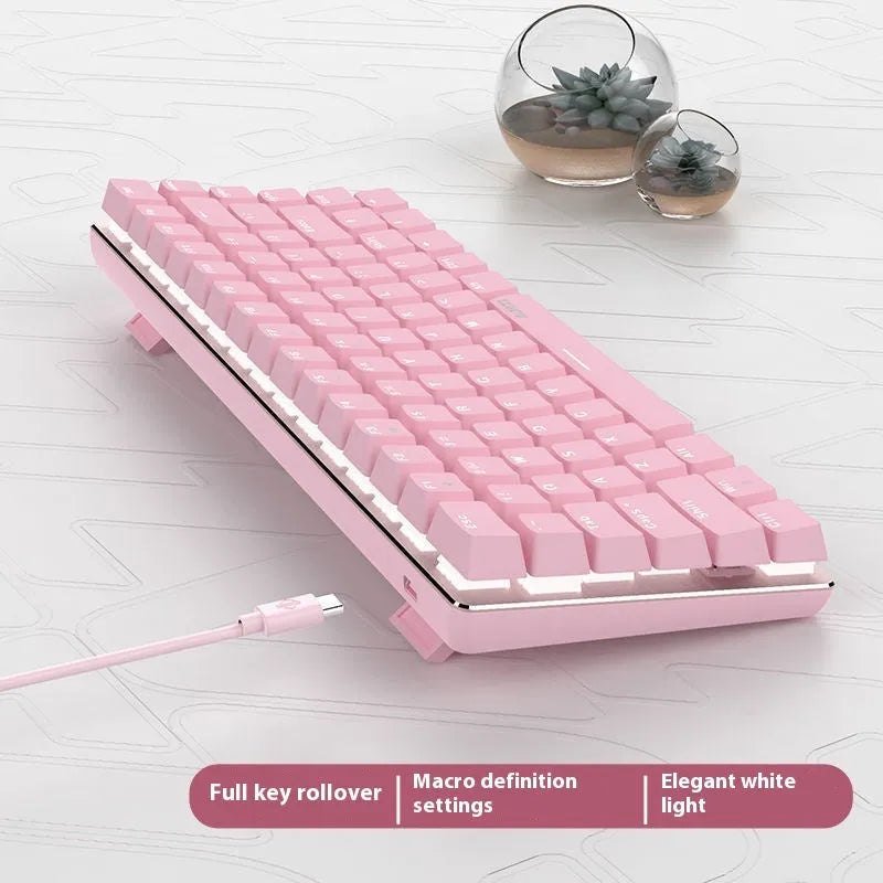 Pink and white 82 key mechanical keyboard with white backlight on a desk