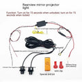 Car rearview mirror courtesy lamp projecting white angel wings light onto ground near vehicle door