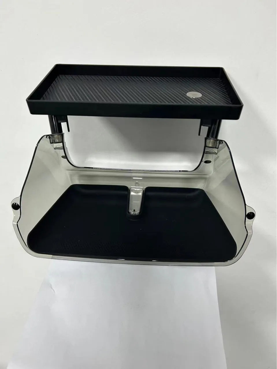 Black ABS storage box placed under Tesla Model 3 centre screen