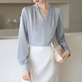 Women's long sleeve solid blue satin shirt with slim fit and 3D stitching, front view