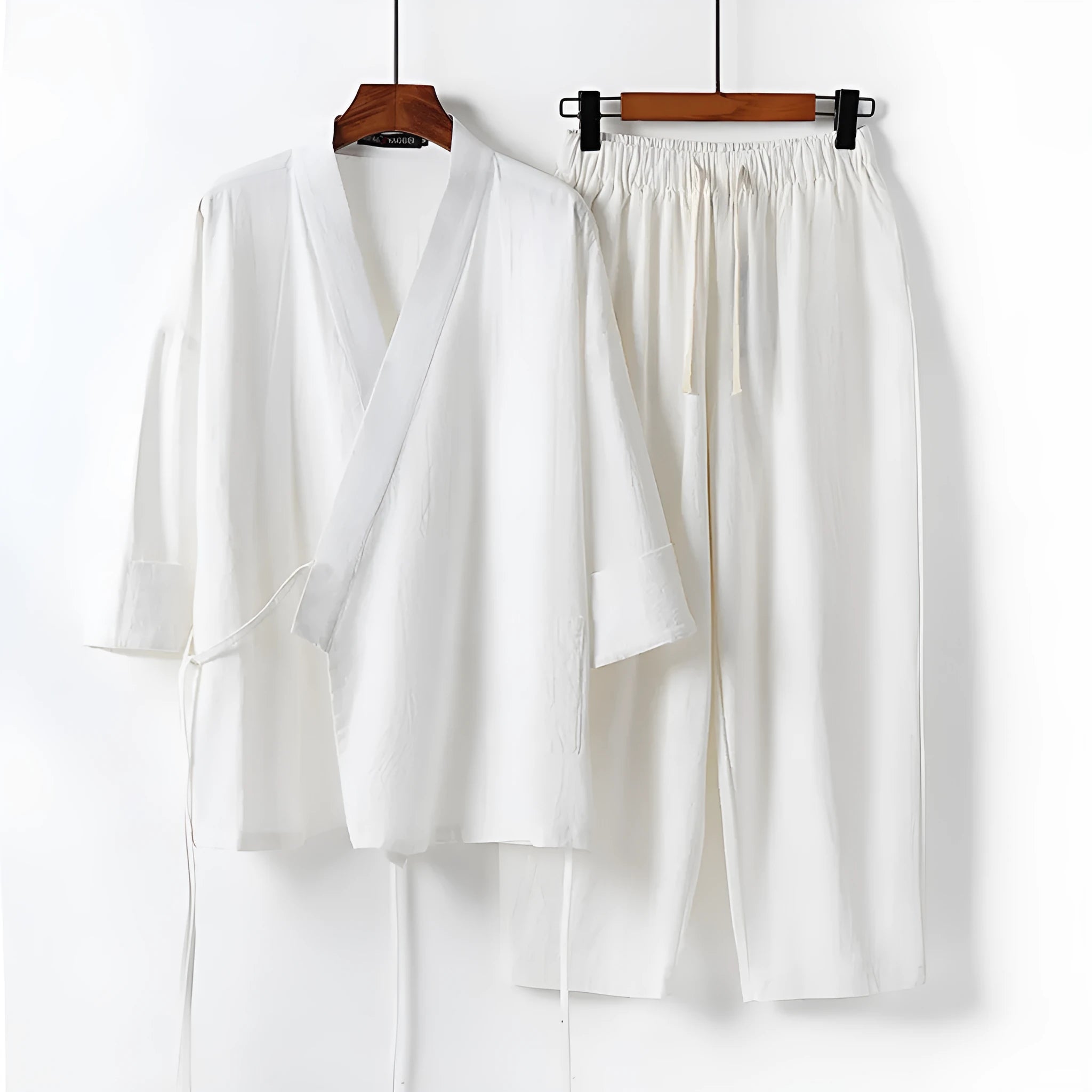 Cotton and linen Hanfu two-piece suit in apricot with shirt-style top and matching trousers on a model