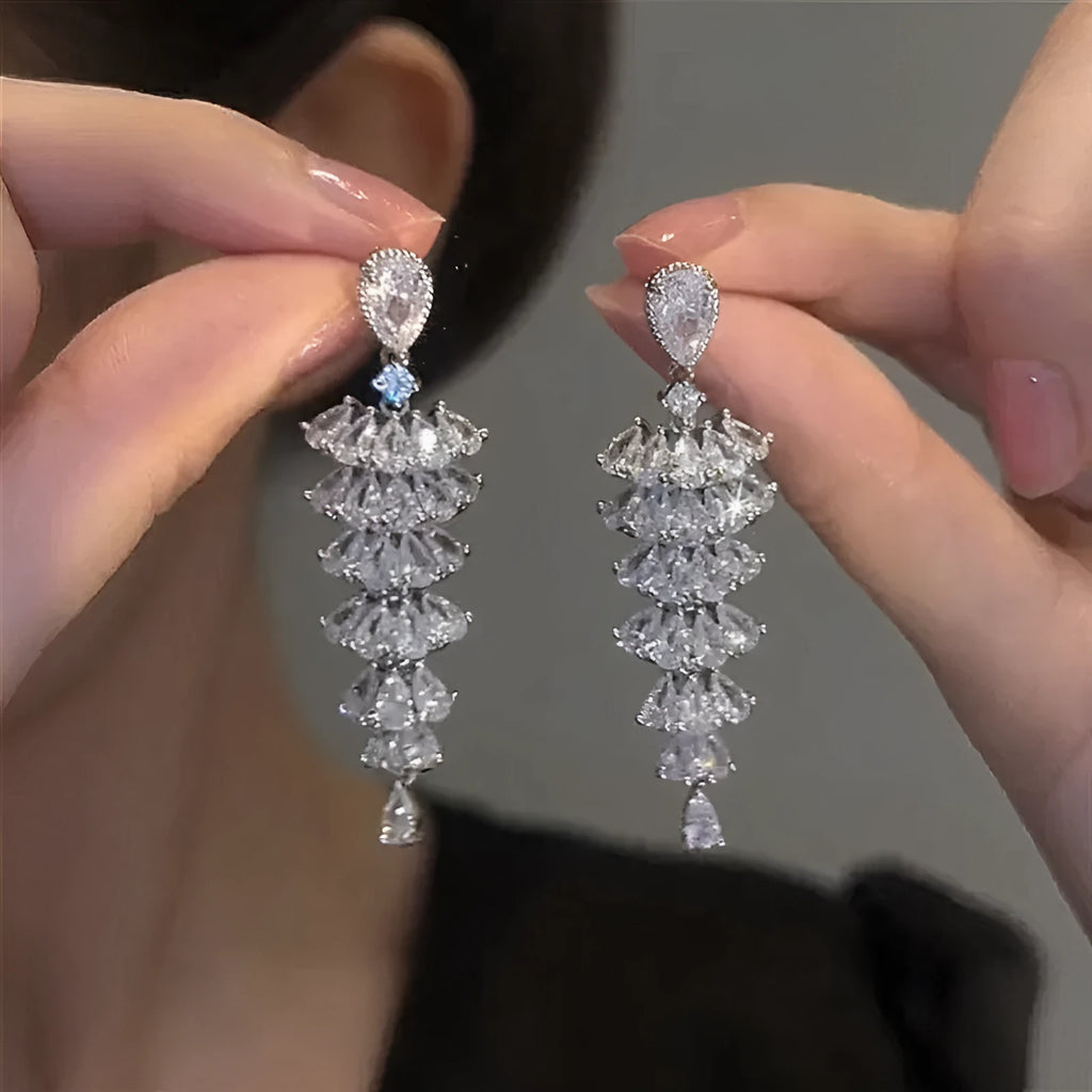 Pair of silver-coloured Christmas tree drop earrings with pagoda shape on stud fastenings.