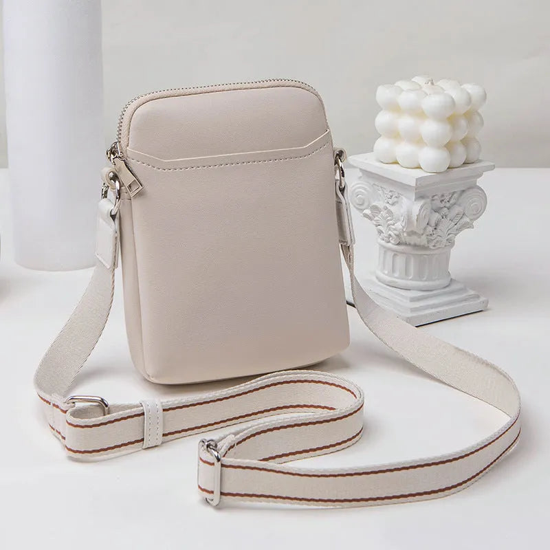Solid colour PU leather small crossbody phone bag measuring 14.5cm by 5.5cm by 19cm