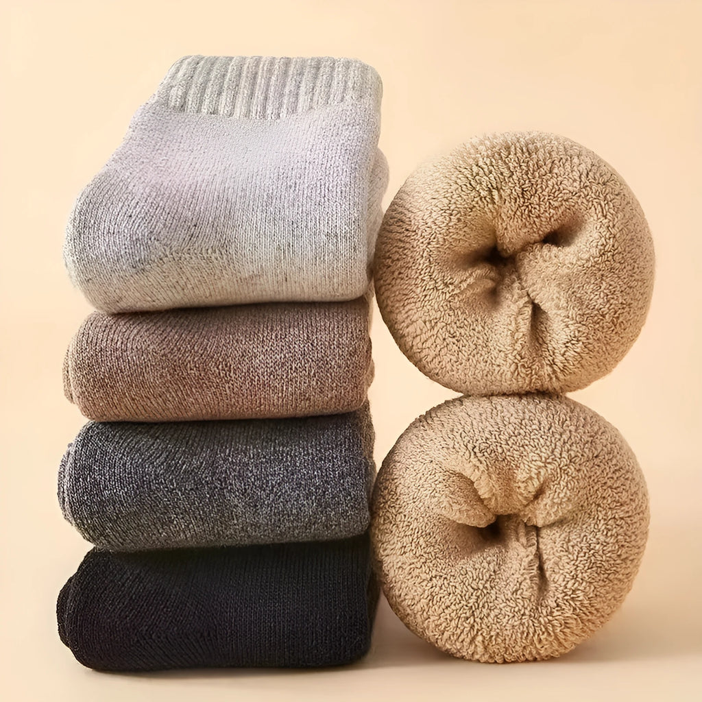 Men's thick wool winter socks in black, khaki, light grey, and dark grey, showing minimalist design.
