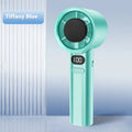 Green handheld USB fan showing variable speed control dial and six plastic blades