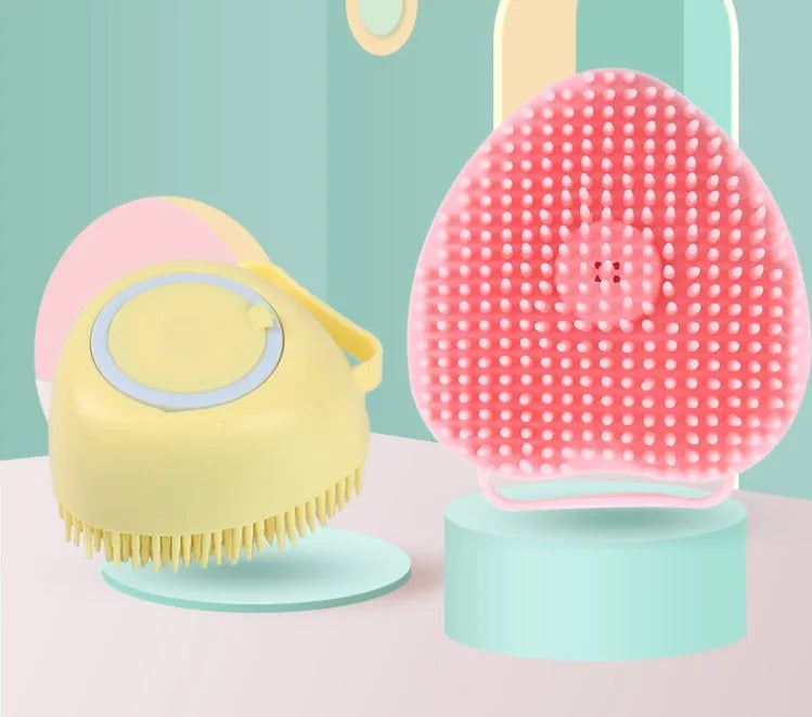 Silicone dog bath brush in blue, pink, and yellow colours, compact 9x6x8.5cm grooming tool