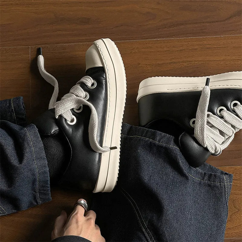 Men's black leather slip-on casual shoes with raised bottom board and round toe, side view