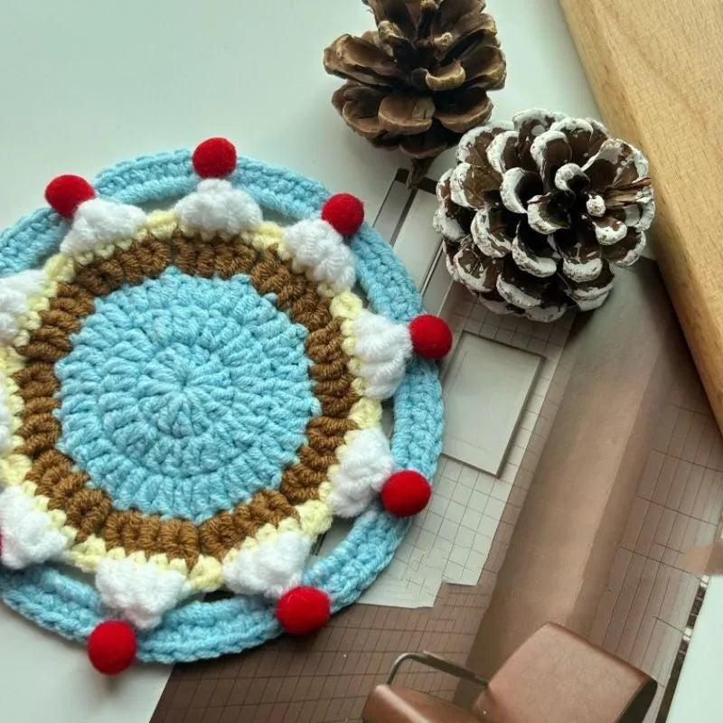 Round wool cake coaster 9cm diameter on a wooden table