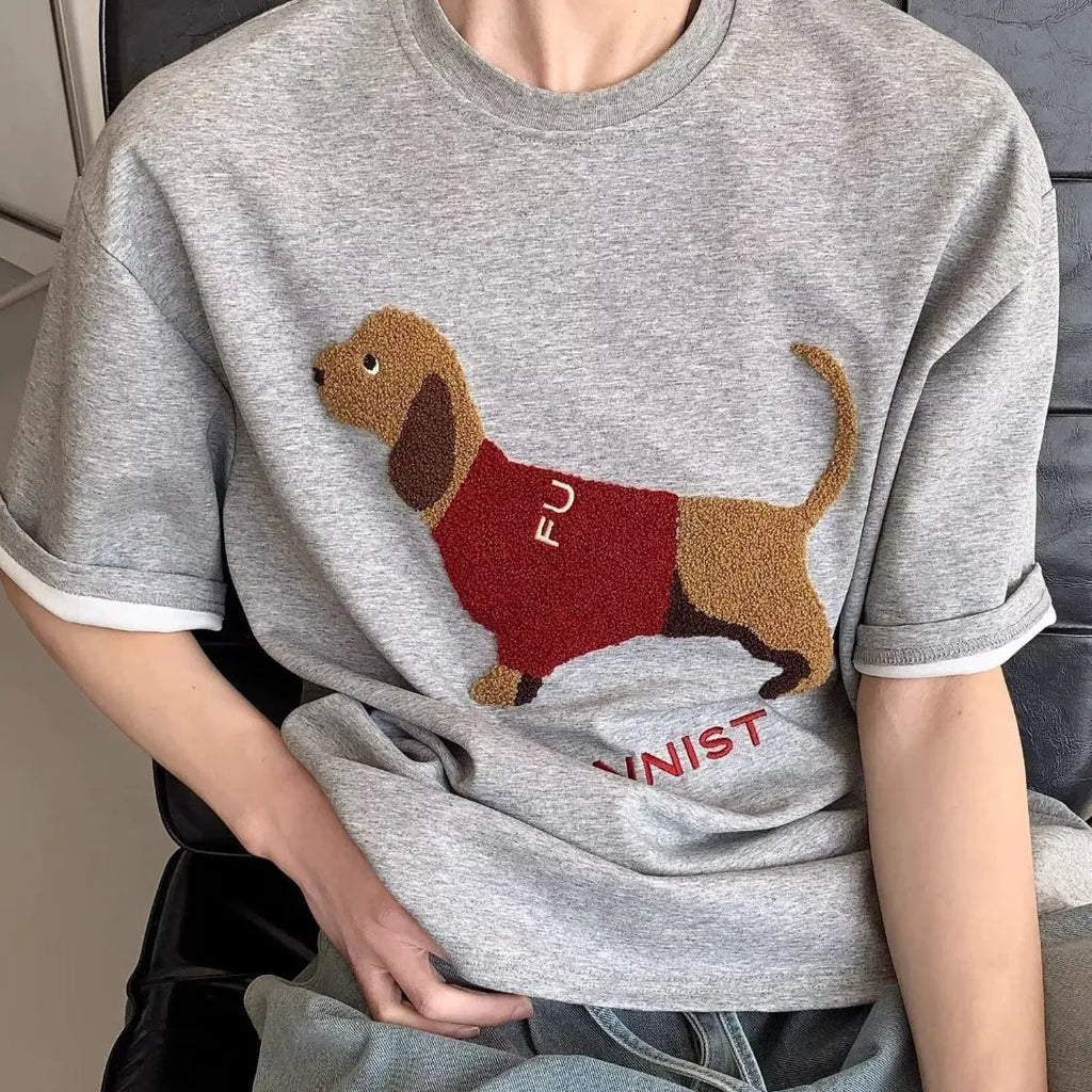 Grey men's short-sleeve cotton T-shirt with an embroidered sausage dog design on the chest.