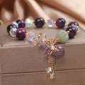 Women's retro transport bracelet with purple tigereye pendant, crystal and rhinestone accents