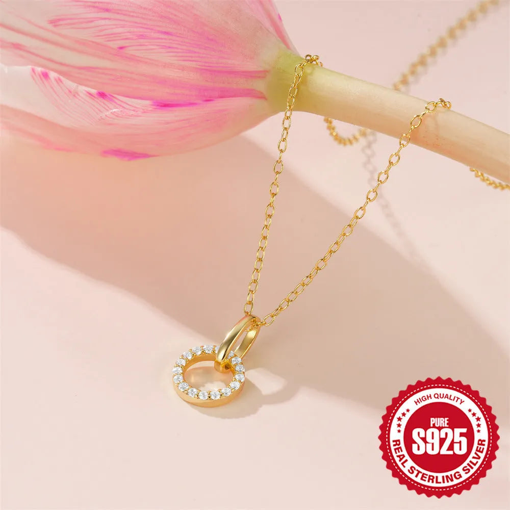 Gold tone S925 sterling silver adjustable clavicle chain necklace with a geometric interlocking zircon pendant.