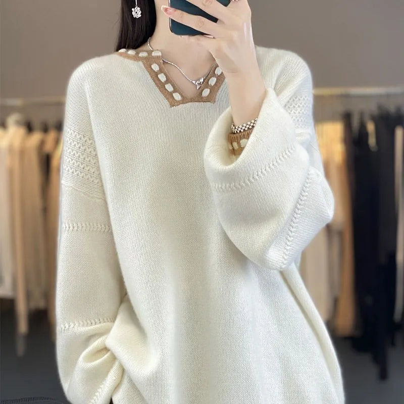 Women's camel coloured V-neck long sleeve viscose pullover sweater on a hanger.