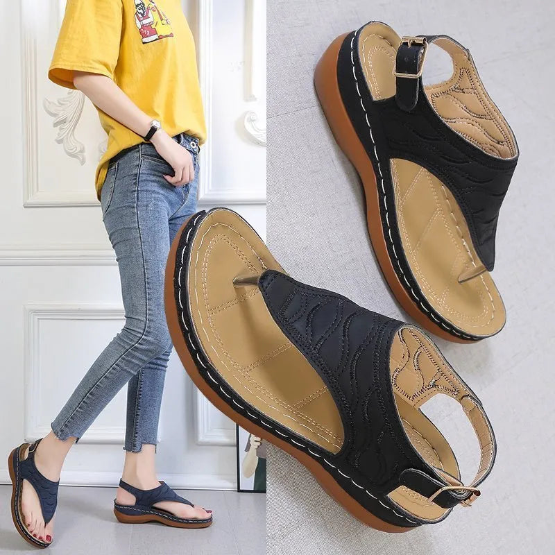 Women's casual wedge heel sandals in black with an adjustable back strap buckle.