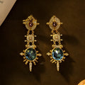Gold retro geometric stud earrings with round design elements and diamond treatment