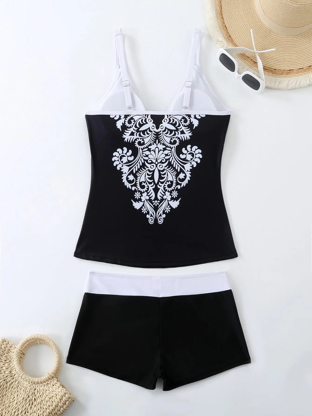 Plus size women's printed two-piece swimsuit in black or rose red with briefs style bottom.