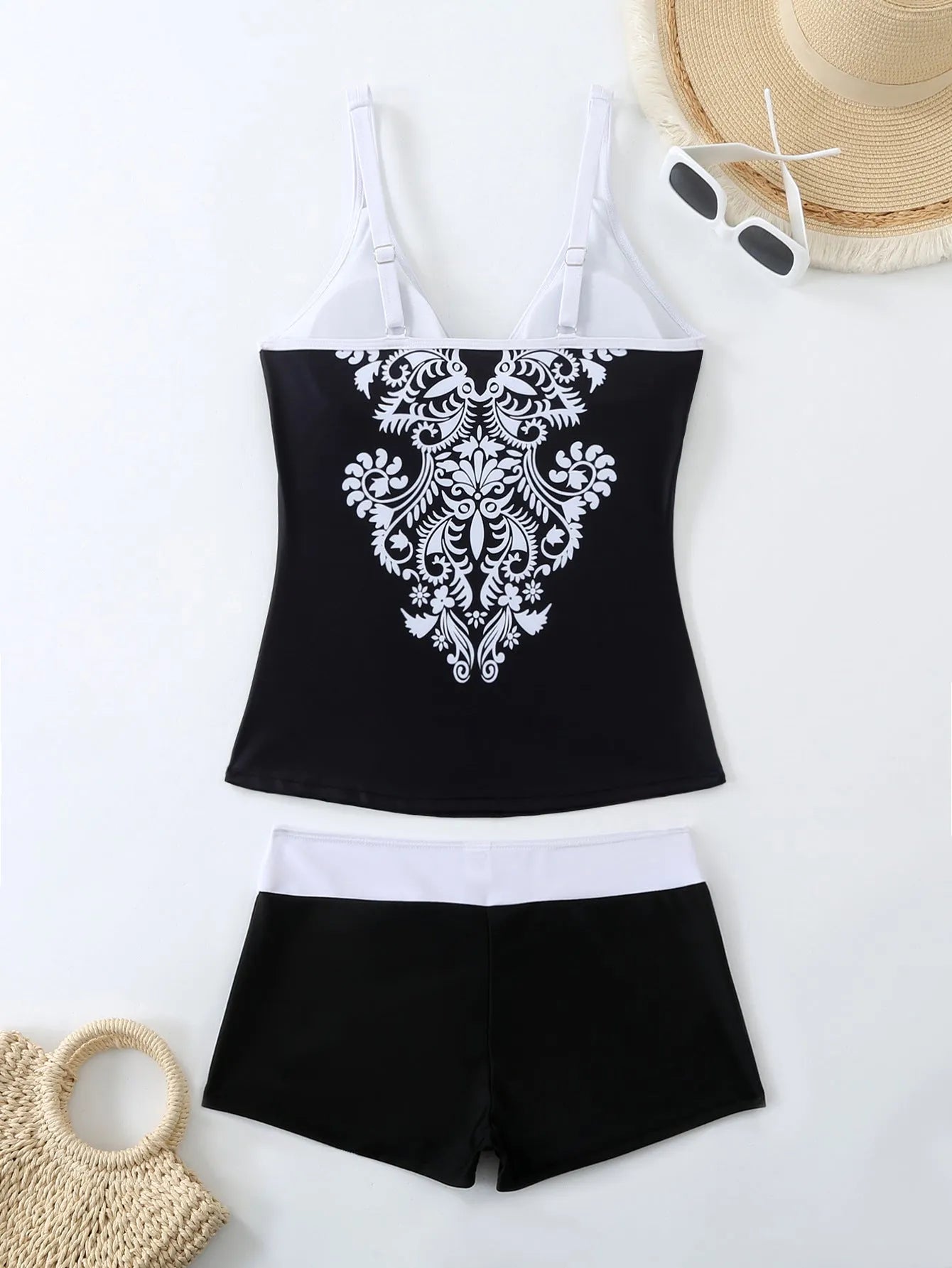 Plus size women's printed two-piece swimsuit in black or rose red with briefs style bottom.