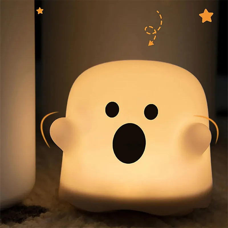 Silicone night light LED touch sensor lamp for kids bedroom in pink, showing soft glow on a bedside table