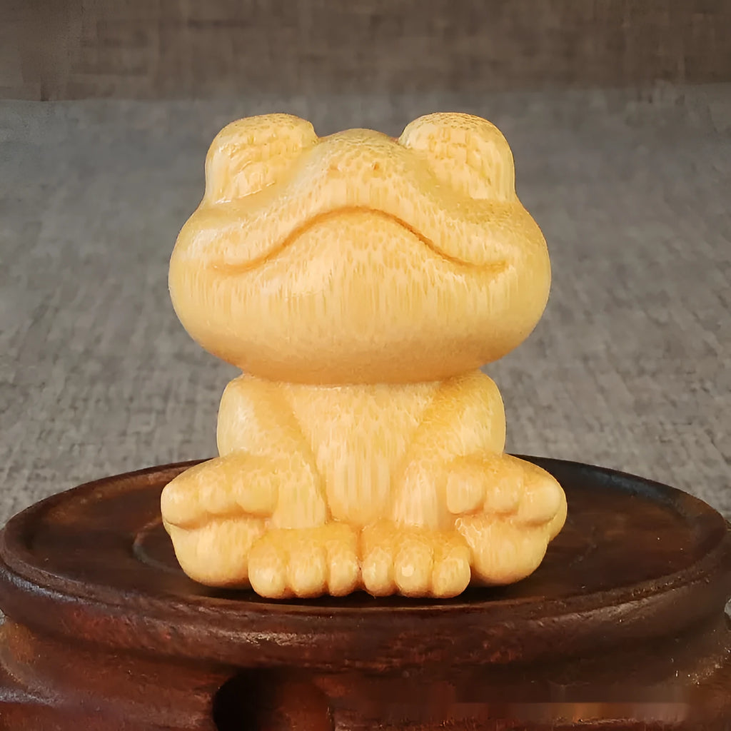 Solid bamboo smiling frog cartoon ornament measuring 5cm tall.