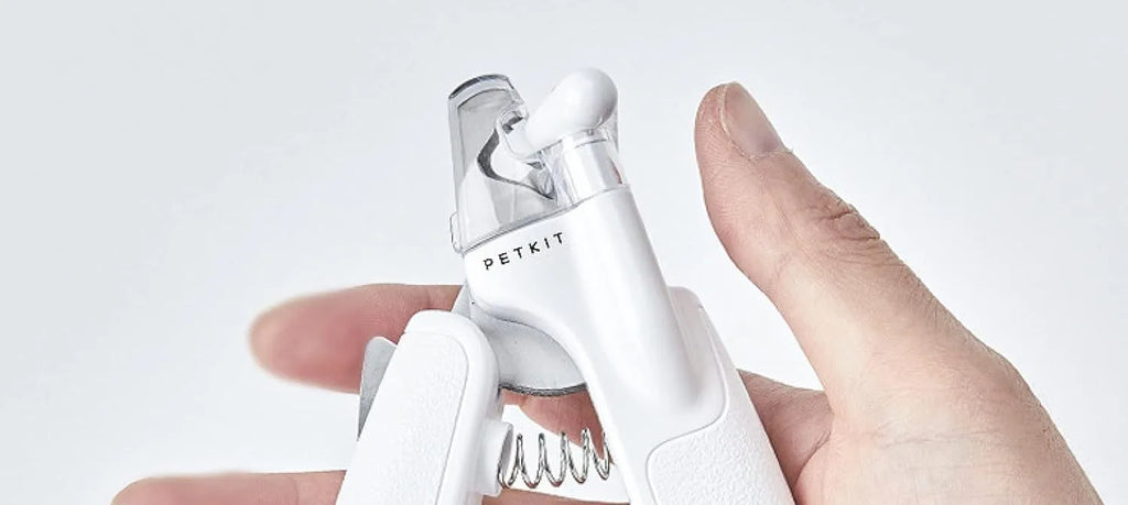 White pet nail clippers with LED light, transparent anti-splash guard, and a leather-like handle.