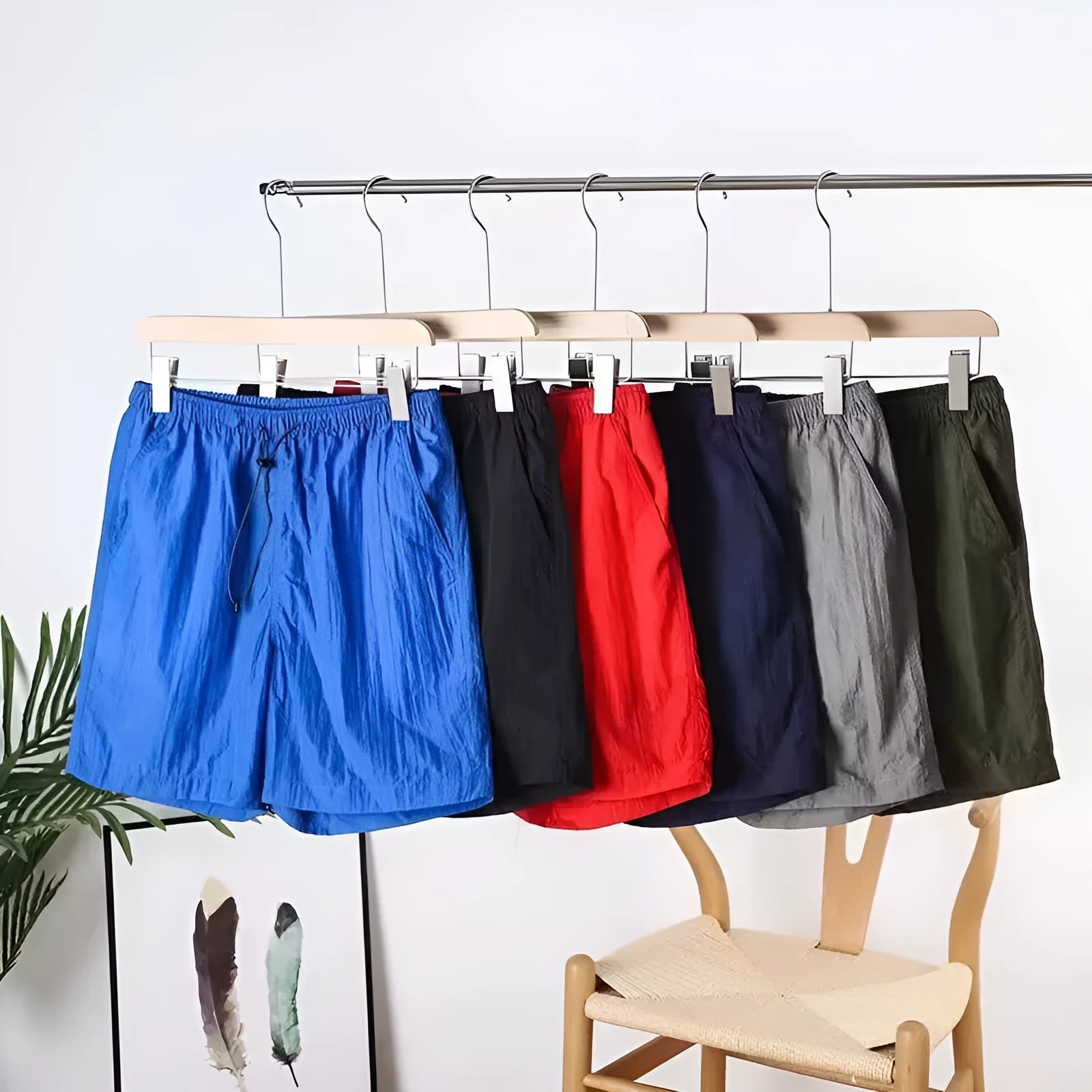 Men's quick-drying polyester blend sports shorts in blue with straight leg, available in multiple sizes