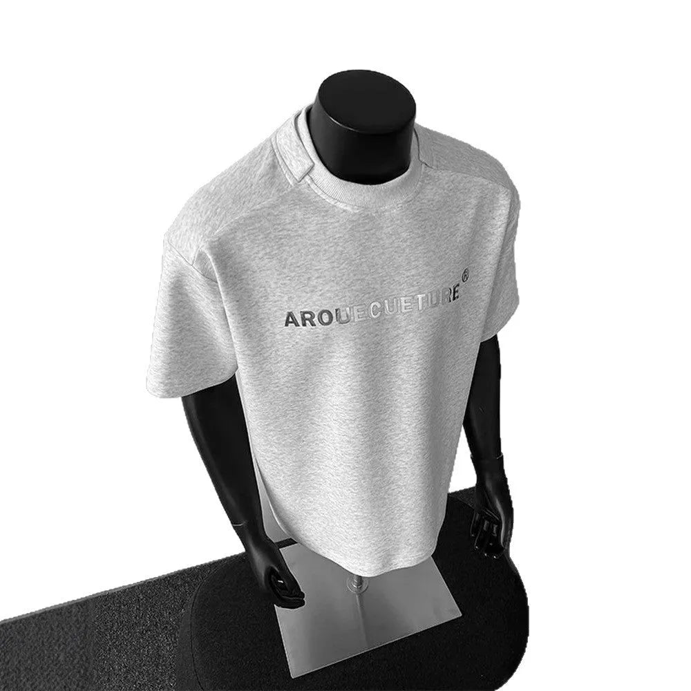 Men's short sleeve cotton shirt in loose pullover style available in black, white, and light grey