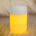 Small white cylindrical USB-powered humidifier with aromatherapy function on a desk