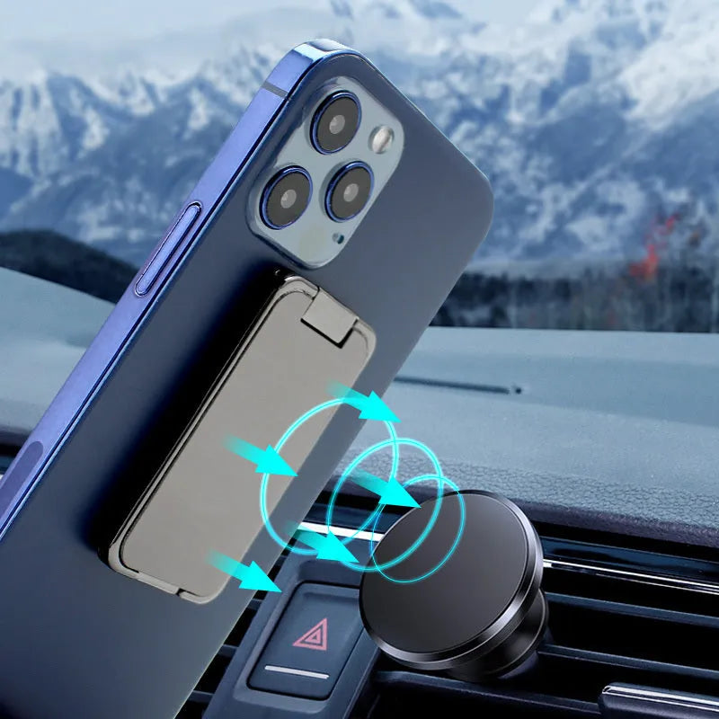 Foldable zinc alloy phone holder ring buckle in silver on a desk propping an iPhone at an angle.