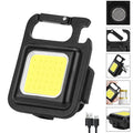 Black aluminium alloy COB keychain light with magnetic base, foldable handle, and key ring, 6x4.2cm