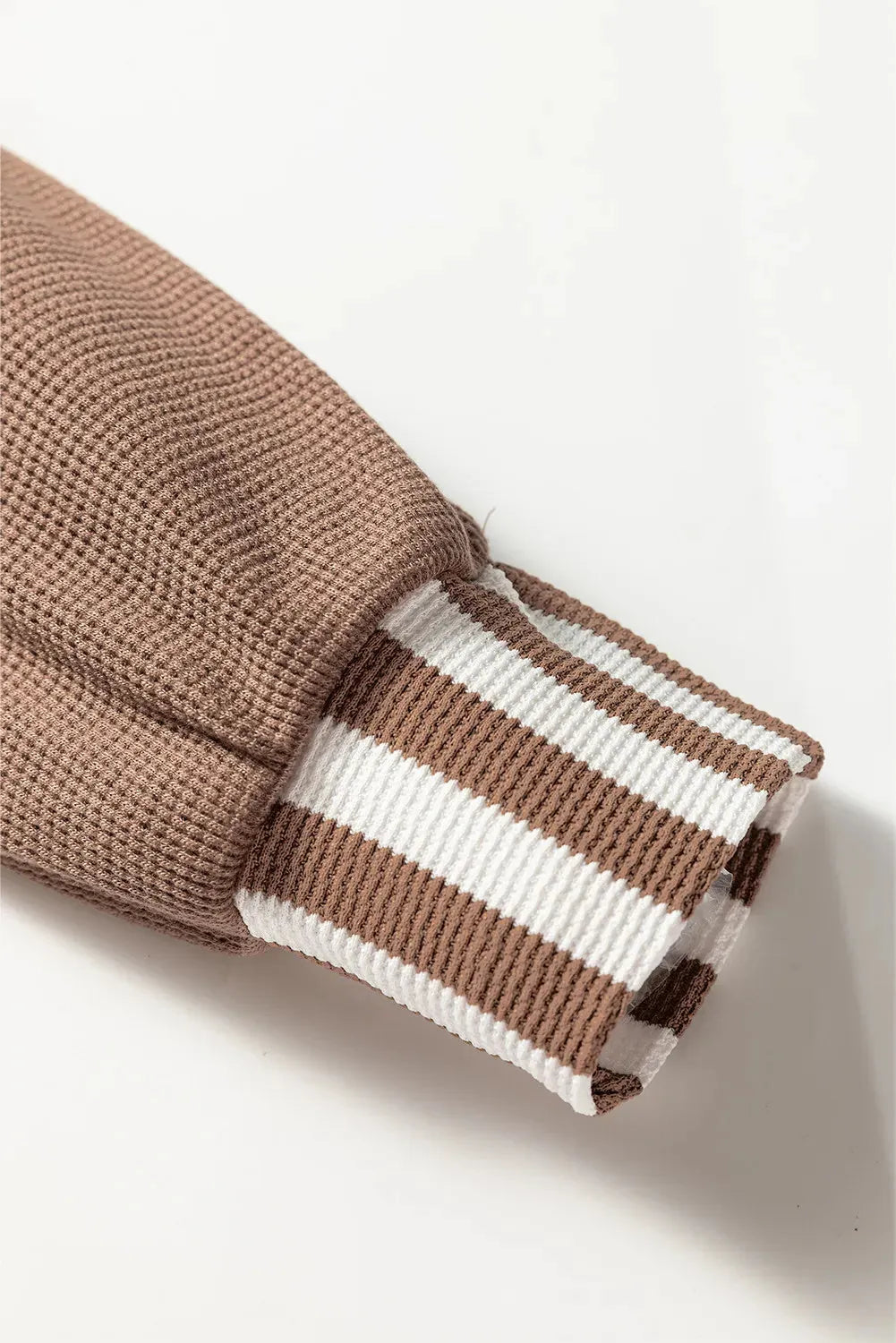 Straw yellow women's hoodie with waffle texture, patchwork stripes, a drawstring hood, and button neck.