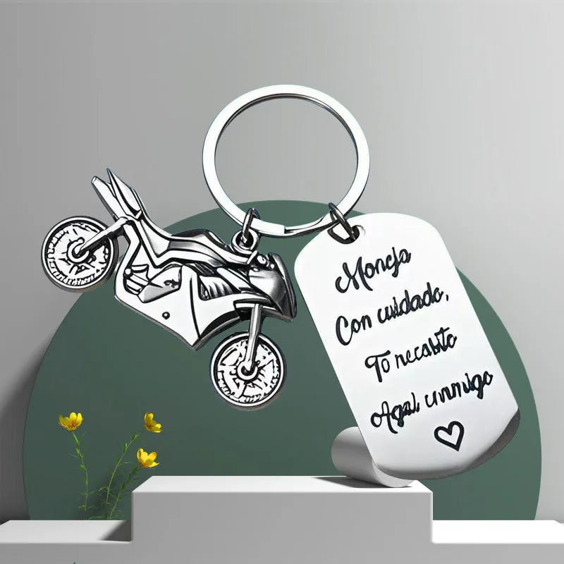 Stainless steel inspirational motorcycle keychain with metal ring and flannel storage bag.