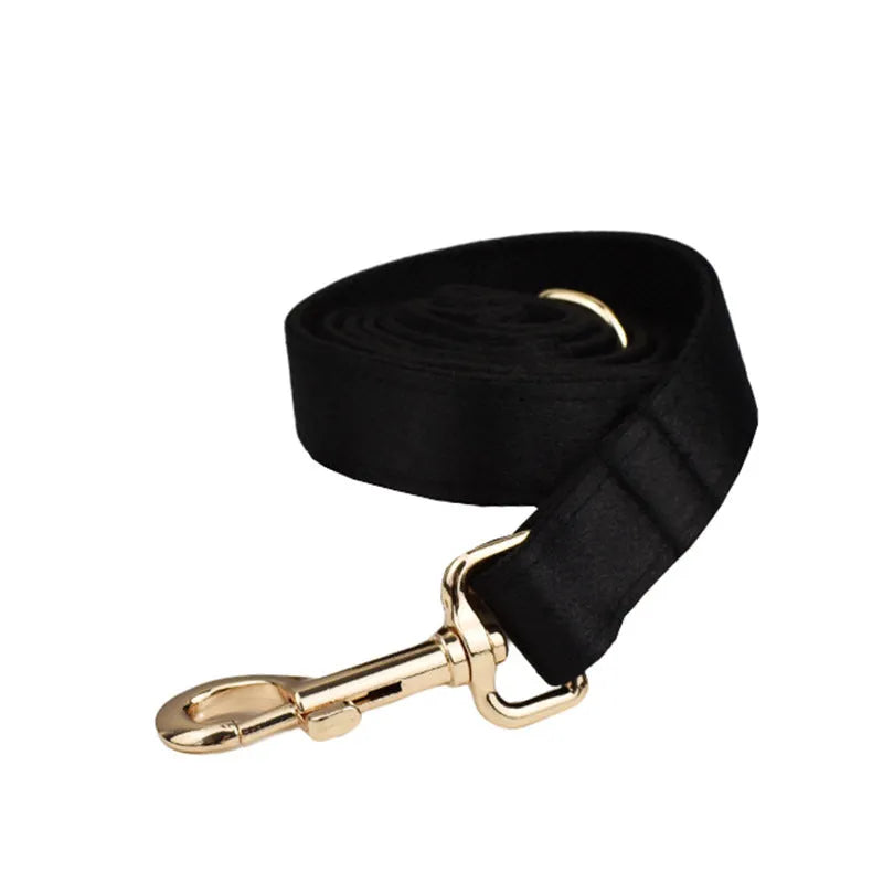 Pet harness set showing cloth collar, leash, decorative bow, and matching vest in four available sizes