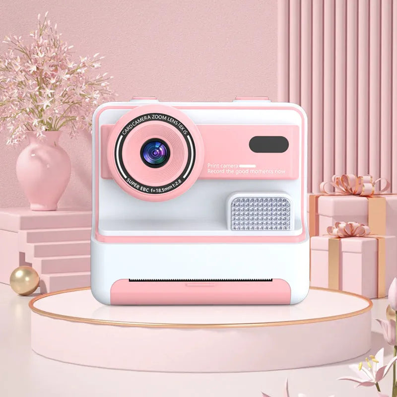 Children's dual lens printing camera in blue with ABS body, 94x56.8x89.2mm, showing front camera and lanyard