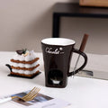 Ceramic binaural hot pot cup in brown for melting chocolate with fork and candle beside it