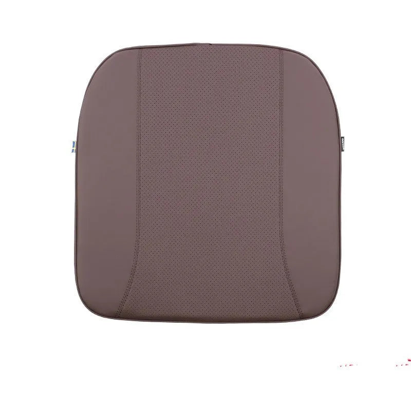 Minimalist brown synthetic fibre headrest cushion and neck pillow for a Volvo car seat.