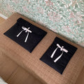 Women's black quilted computer bag with ballet bow and striped pattern