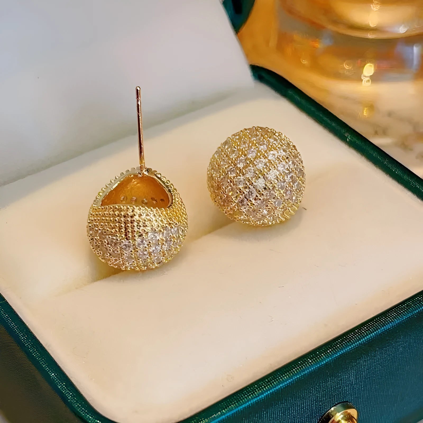 Women's geometric drop-shaped gold earrings with full diamond little golden beans design and spherical elements