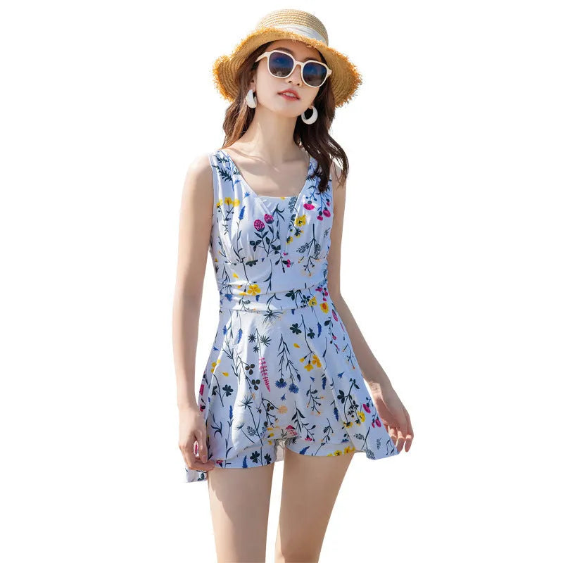 Women's one-piece floral printed swimsuit in white polyester, front view, sizes M to 2XL
