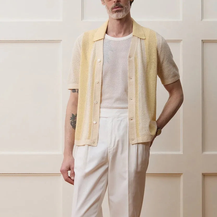 Yellow men's short-sleeve polo shirt with hollow-out design and asymmetric cut.