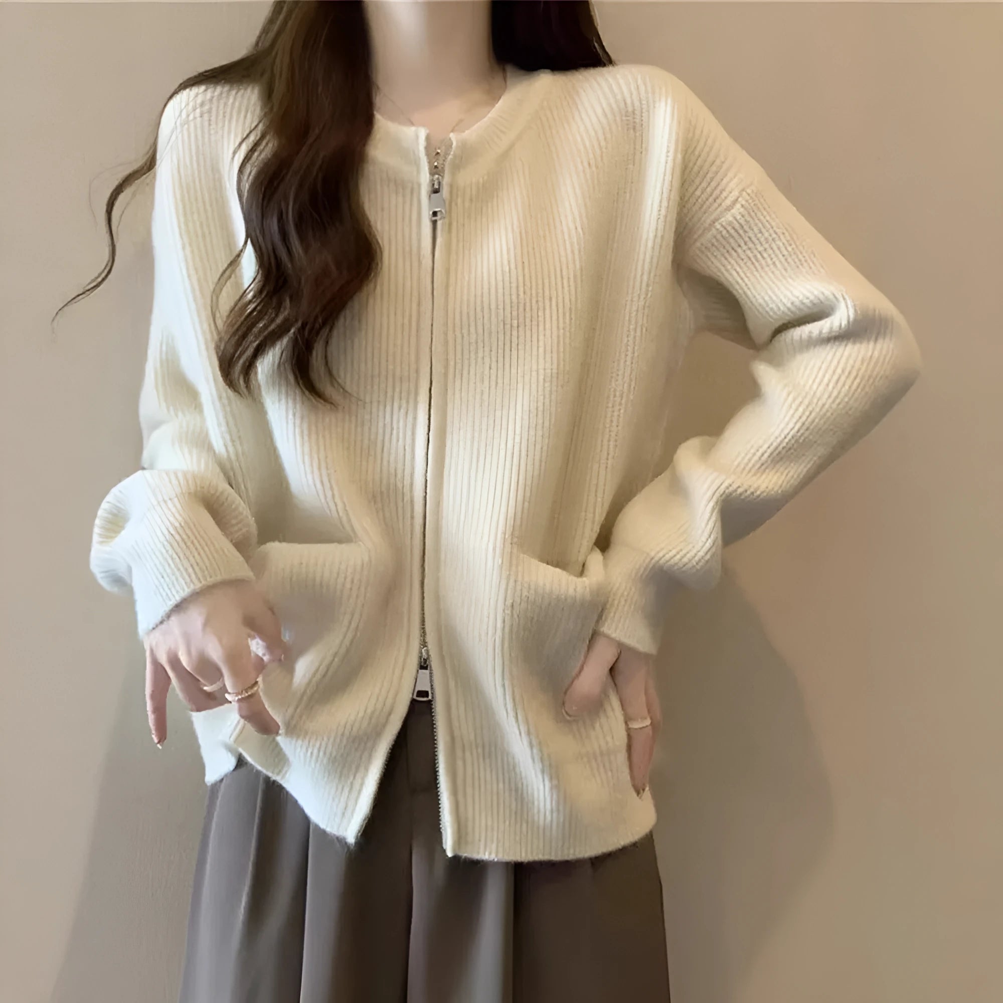 A beige soft glutinous sweater coat cardigan with long sleeves, shown buttoned.