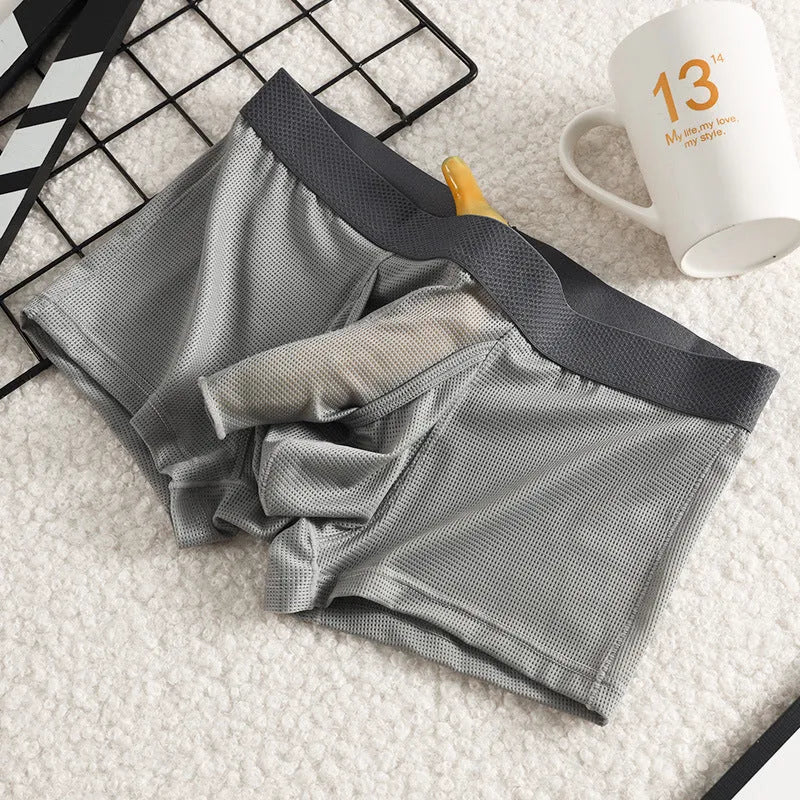 Men's ice silk boxer in black with mesh knit fabric, low waist, and solid colour design