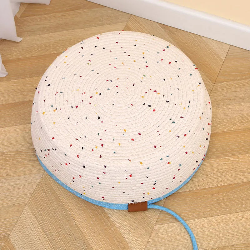 Cotton and hemp rope cat nest mat in large size with dangling toy ball, placed inside a cage