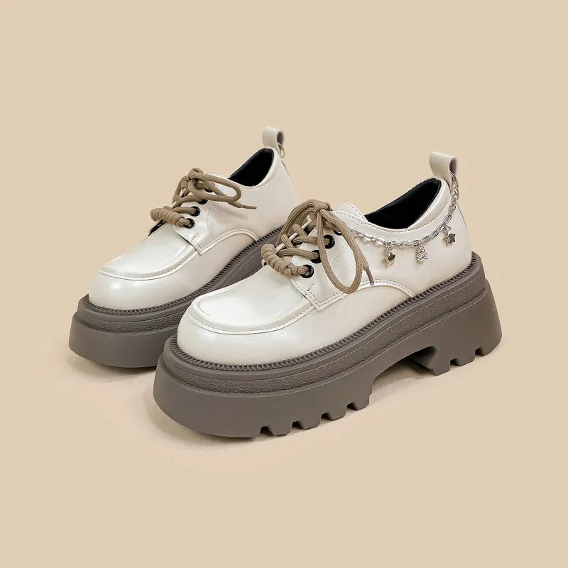 White women's Mary Jane platform shoes with thick chunky heel and front lace-up detail.