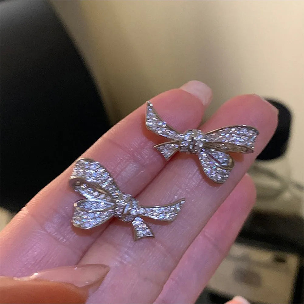Gold electroplated copper bowknot earring with miniature zircon inlay on silver needle post